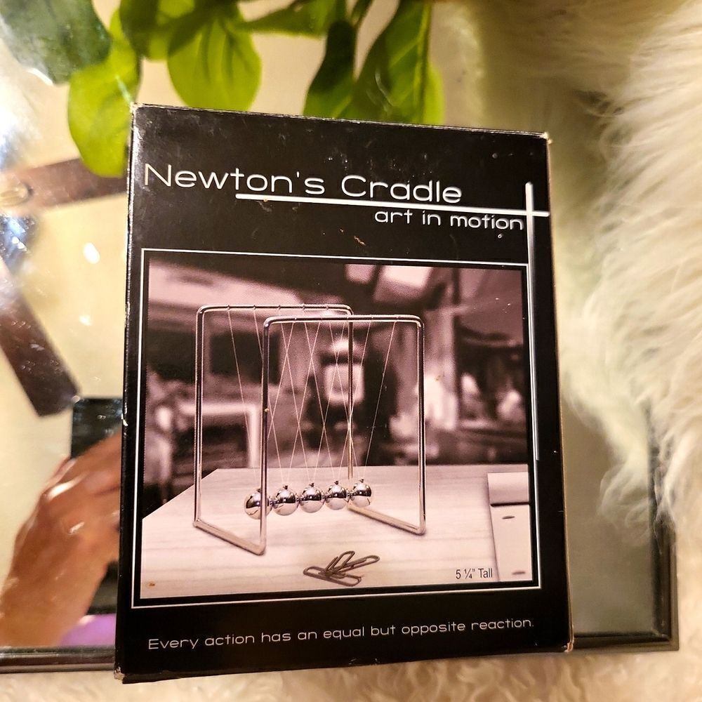 NIB, newton's cradle art in motion 5 1/4 inch tall